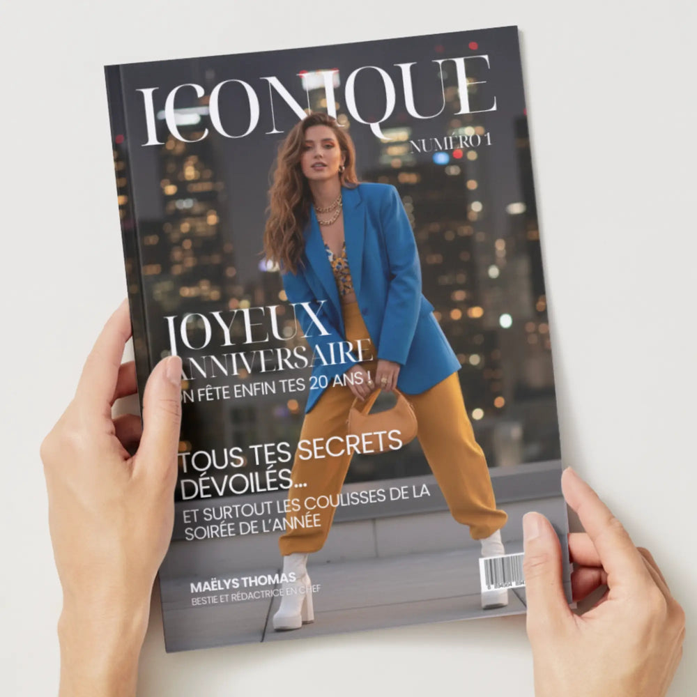 Mains tenant le magazine bestie au format A4 pour l'anniversaire des 20 ans