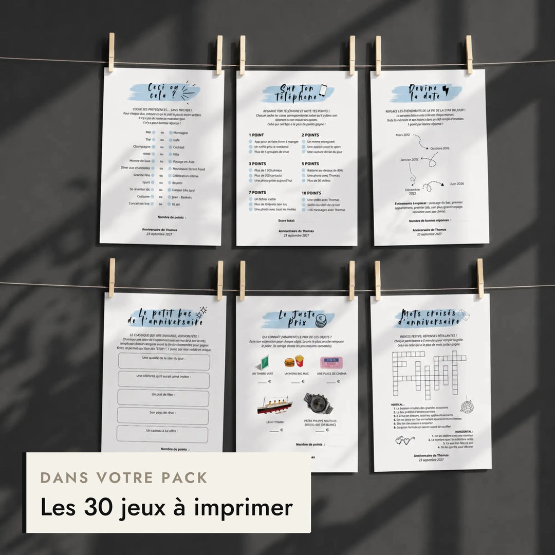 Fiches de jeux d'anniversaire pour lui suspendues à un fil, incluses dans le pack anniversaire homme.