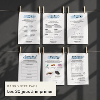 Fiches de jeux d'anniversaire pour lui suspendues à un fil, incluses dans le pack anniversaire homme.