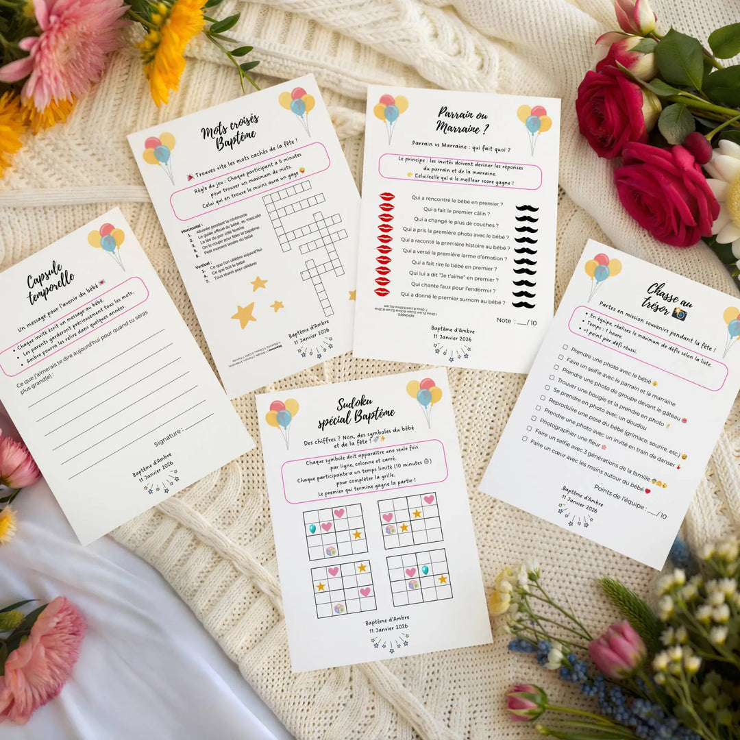 Photo de jeux baptême personnalisé sur une couverture avec des fleurs.