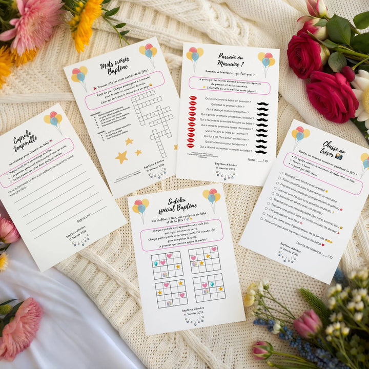 Photo de jeux baptême personnalisé sur une couverture avec des fleurs.